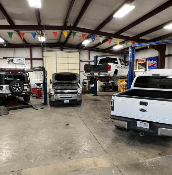 cars on lifts  - interior of garage