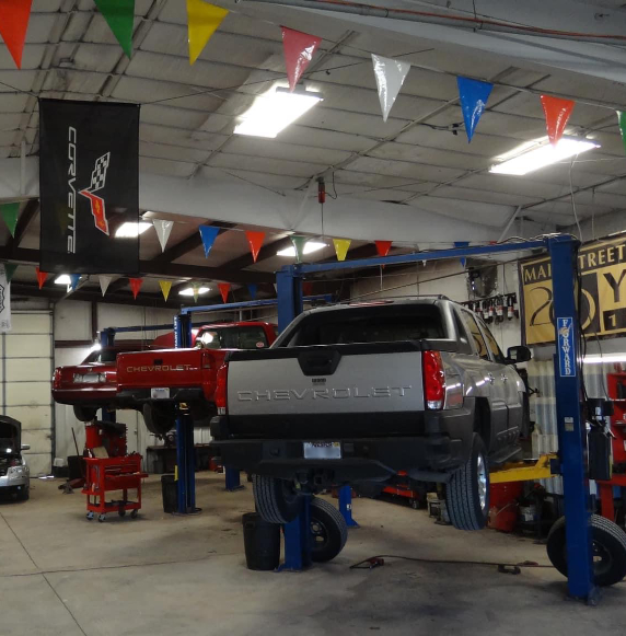 chevrolet car on lift